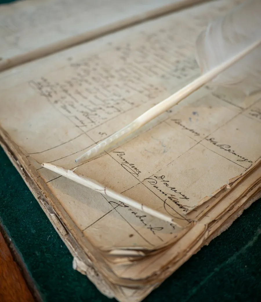 An open handwritten ledger of ruled entries and signatures